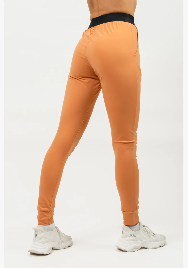 NEBBIA Slim fit legíny s vreckami GYM SPIRIT oranžová