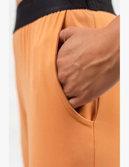 NEBBIA Slim fit legíny s vreckami GYM SPIRIT oranžová