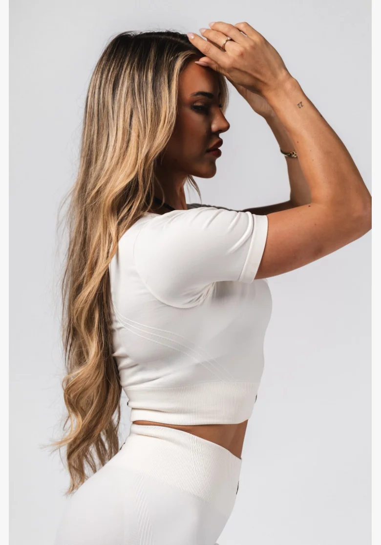 NEBBIA Tvarujúci bezšvový crop top FLOW SEAMLESS krémový